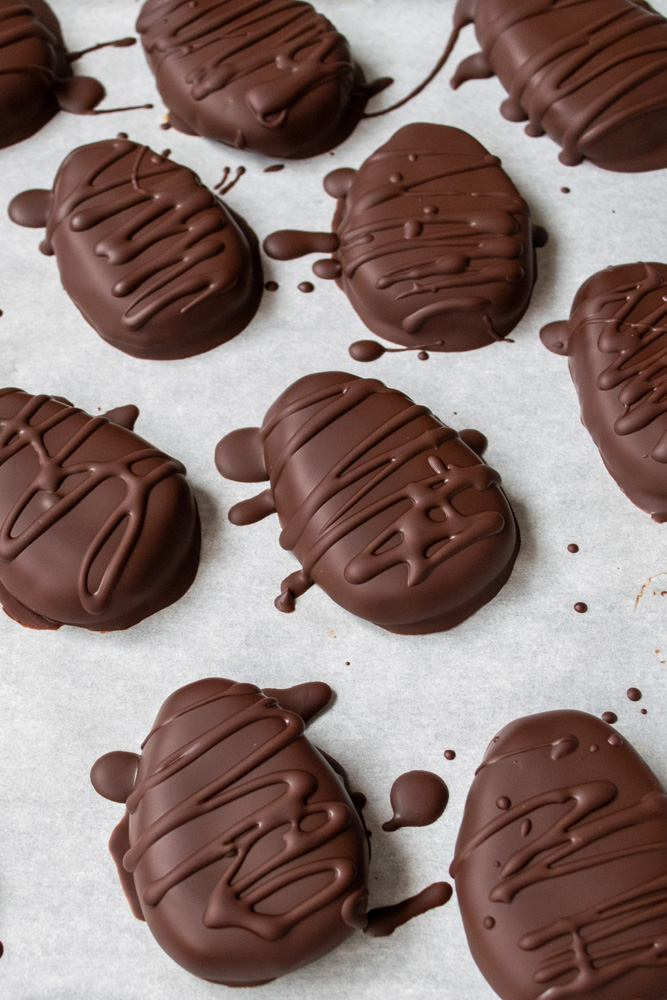 Chocolate peanut butter eggs drizzled with extra melted chocolate.