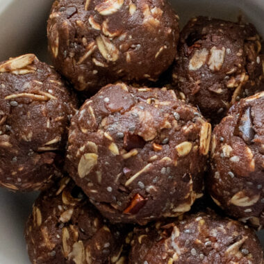 a close up of the energy balls in a white bowl