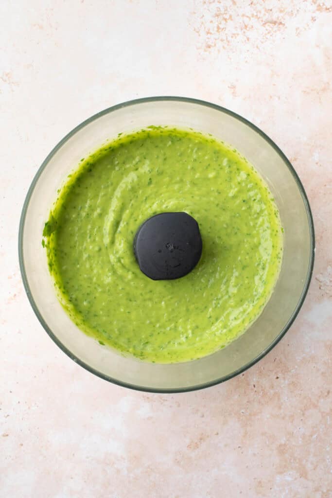 avocado cilantro dressing in a food processor bowl