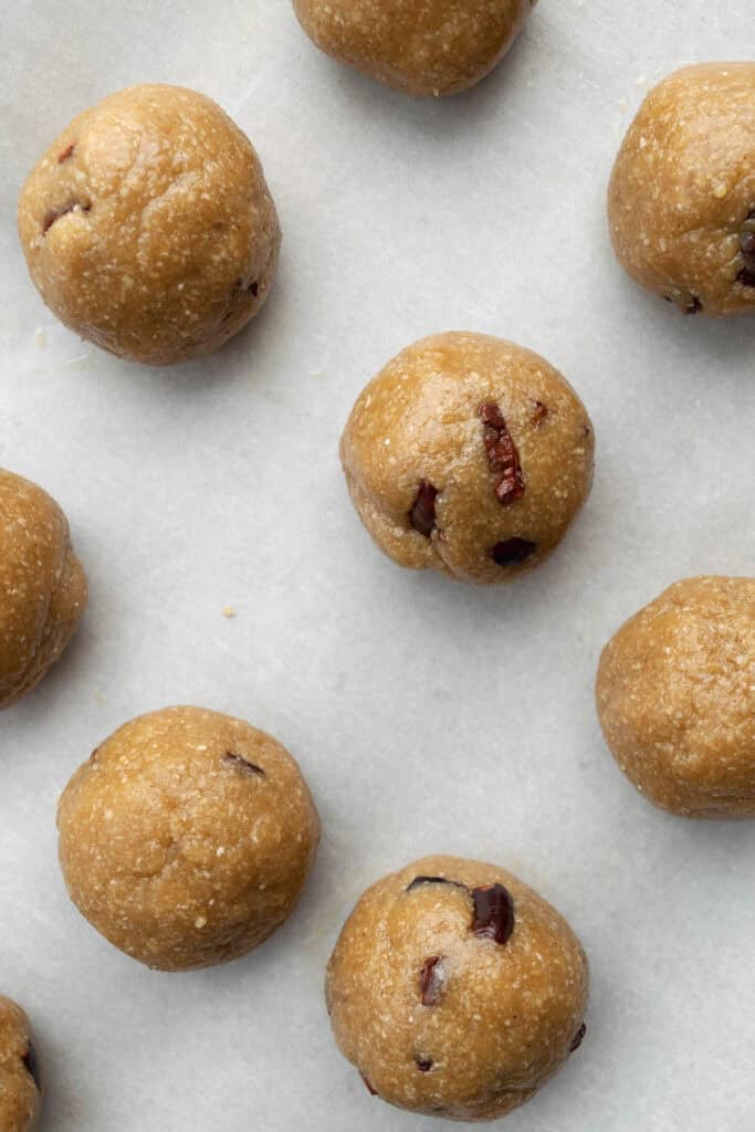 tahini miso cookie dough after being rolled into balls.