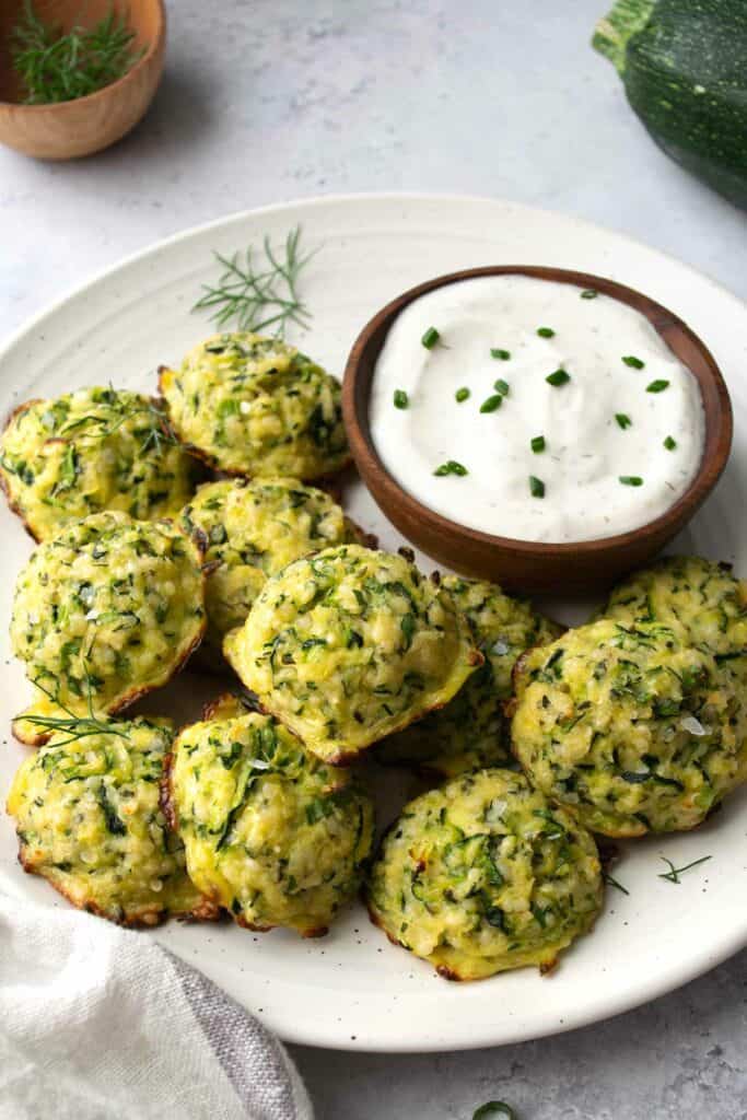 zucchini bites on a white plate.