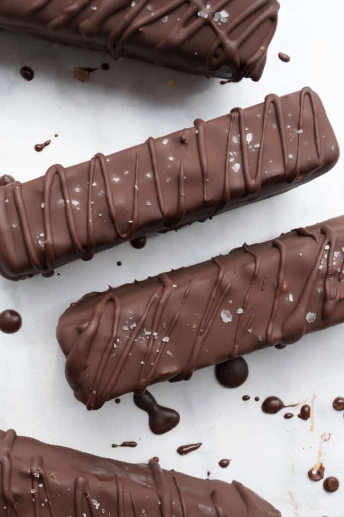 snickers ice cream bars drizzled with chocolate.