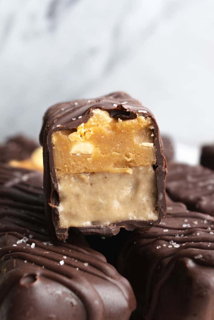 a cut open protein snickers ice cream bar.