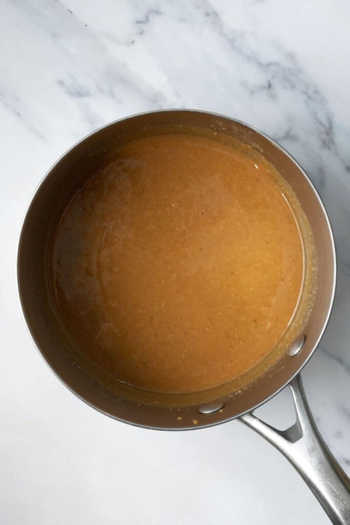 peanut butter caramel in a sauce pan.