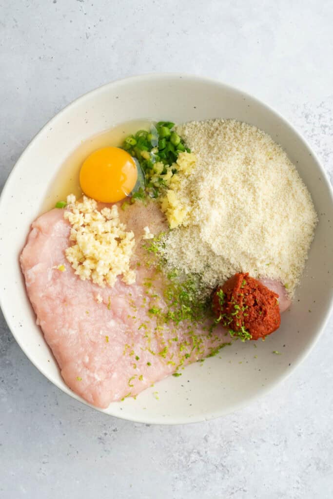 meatball ingredients in a white bowl.