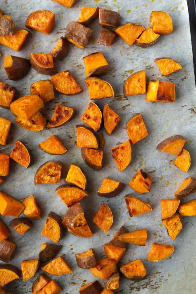 roasted, chopped sweet potato on a baking sheet